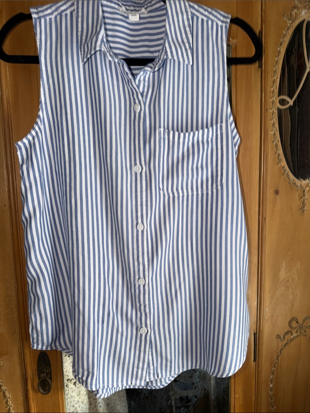 Sleeveless Blue and White Striped Button-Down Top perfect for a sexy warm eve.